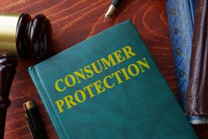 How Consumers’ Rights Are Protected Under The Consumer Protection Act- Gavel and book with the words Consumer Protection